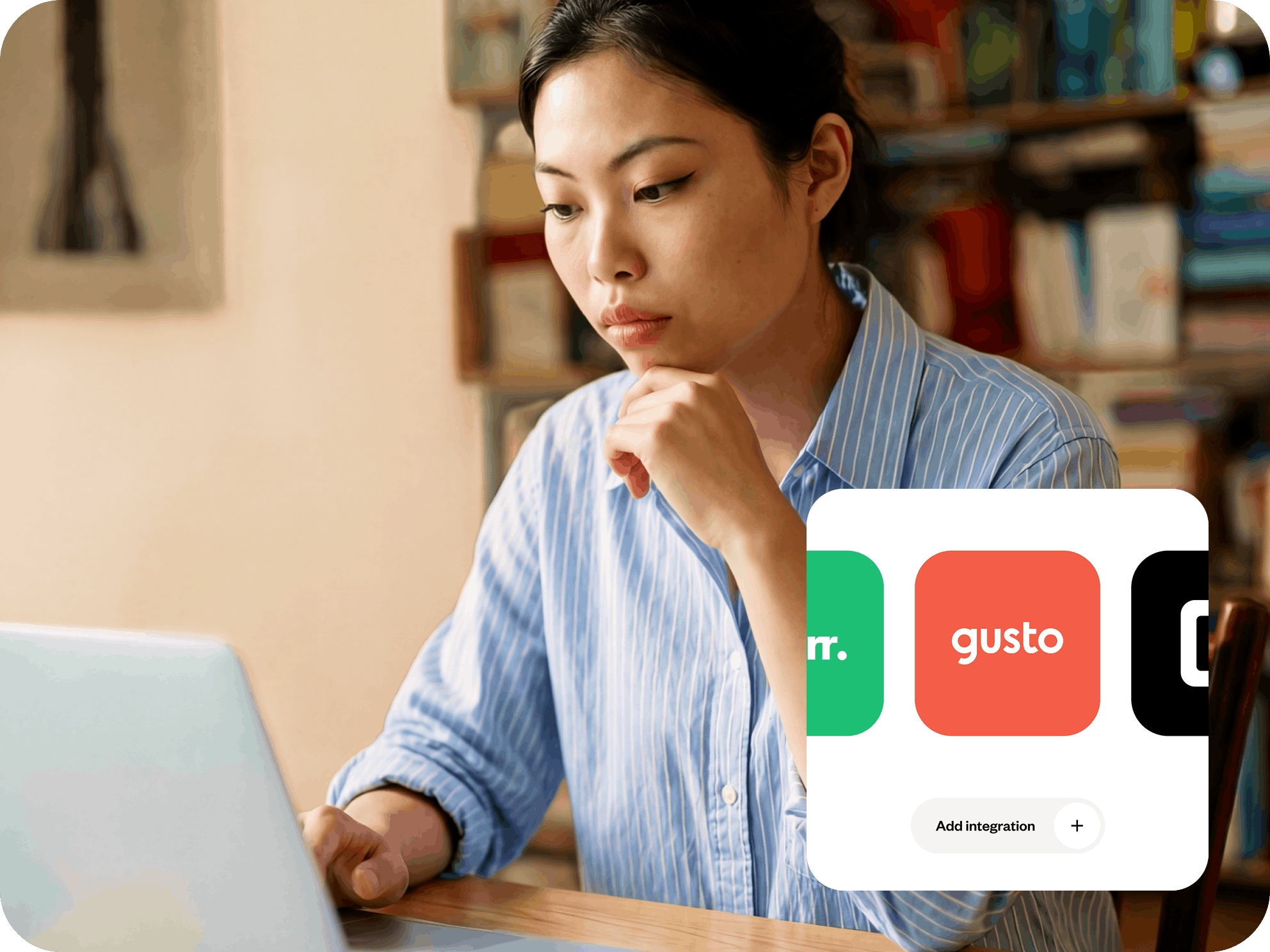 A woman looking at her laptop.