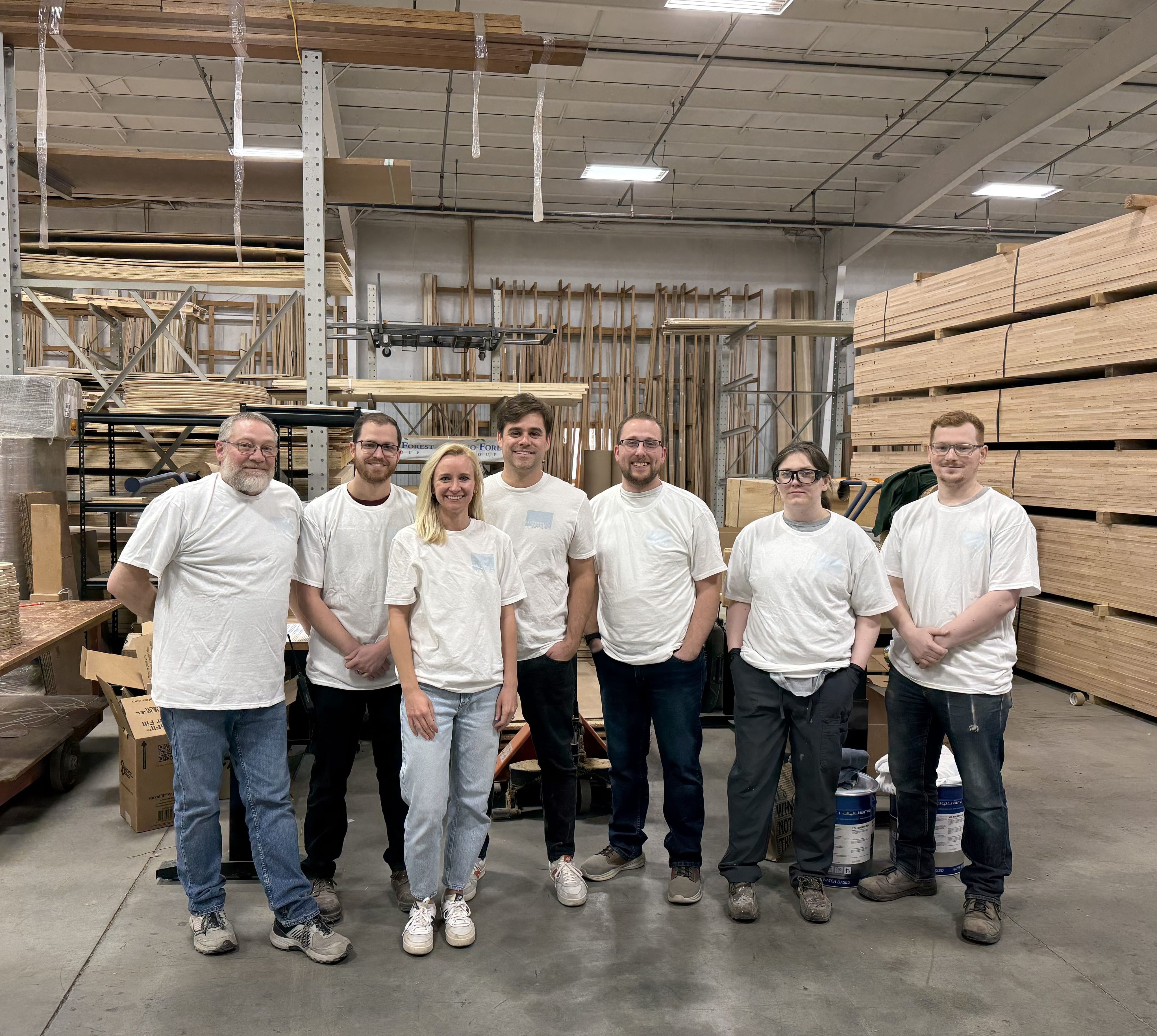 Blueberry and Third cofounders Nikki and Brian Benbenek (third and fourth from left) with members of their new manufacturing team in Ohio.